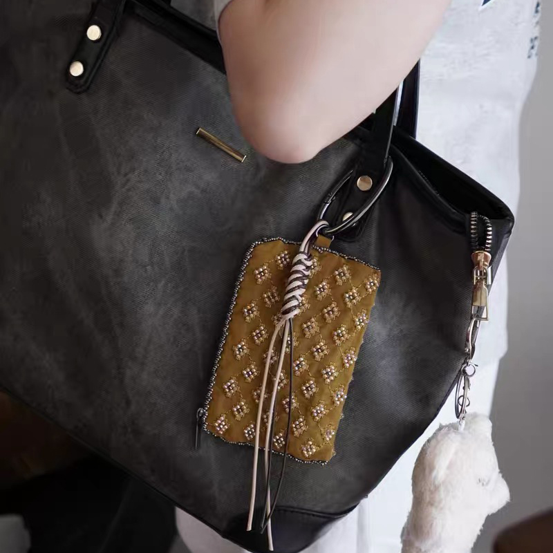 Mini borse con ciondoli per ac - Luxury Bags Design recensione e prezzo